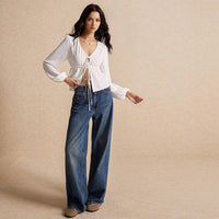 Tie Front Hem Slits Hollow Out Long Sleeve Loose V-Neck Blouse.