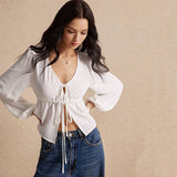 Tie Front Hem Slits Hollow Out Long Sleeve Loose V-Neck Blouse.