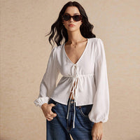 Tie Front Hem Slits Hollow Out Long Sleeve Loose V-Neck Blouse.